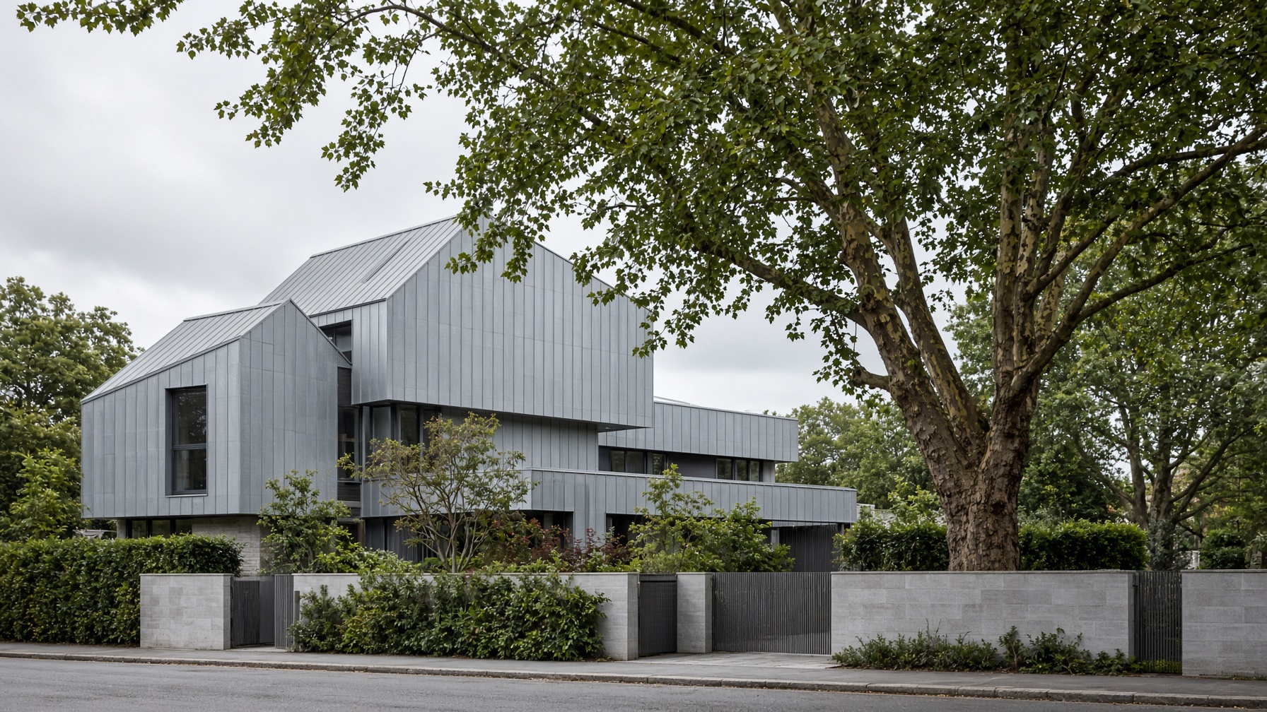 Zinc-clad contemporary house with standing-seam roof and walls
